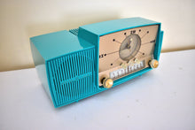 Load image into Gallery viewer, Seafoam Green Turquoise 1959 GE General Electric Model 914D AM Vacuum Tube Clock Radio Excellent Condition Sounds Wonderful!

DESCRIPTION: Table top vacuum tube clock radio manufactured by General Electric in 1959. Seafoam is the rarest color for this GE model series.

SOUND QUALITY: Picks up AM stations clearly around the dial without need of external antenna attachment. 

CABINET CONDITION: Cabinet is in excellent condition. No cracks, no chips, no major scratches. Original factory molded seafoam color pl