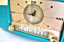 Load image into Gallery viewer, Seafoam Green Turquoise 1959 GE General Electric Model 914D AM Vacuum Tube Clock Radio Excellent Condition Sounds Wonderful!

DESCRIPTION: Table top vacuum tube clock radio manufactured by General Electric in 1959. Seafoam is the rarest color for this GE model series.

SOUND QUALITY: Picks up AM stations clearly around the dial without need of external antenna attachment. 

CABINET CONDITION: Cabinet is in excellent condition. No cracks, no chips, no major scratches. Original factory molded seafoam color pl