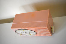 Load image into Gallery viewer, Dolly Pink Retro Space Age 1957 Sylvania Model 6002 Vacuum Tube AM Clock Radio Looks and Sounds Great!