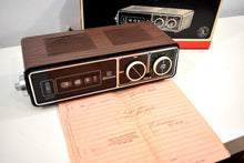 Load image into Gallery viewer, NOS Walnut 70s Emerson Model DCF-75 Roller Clock Solid State AM Radio Works Great Original Box!